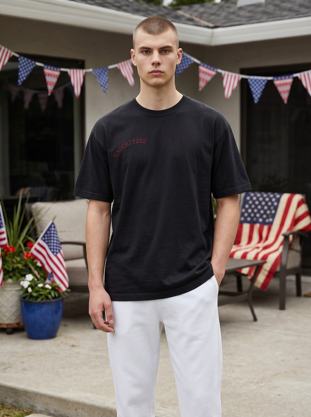 Naughty250 black heavyweight cotton t-shirt with red "Still Shooting 250 America" graphic on chest.