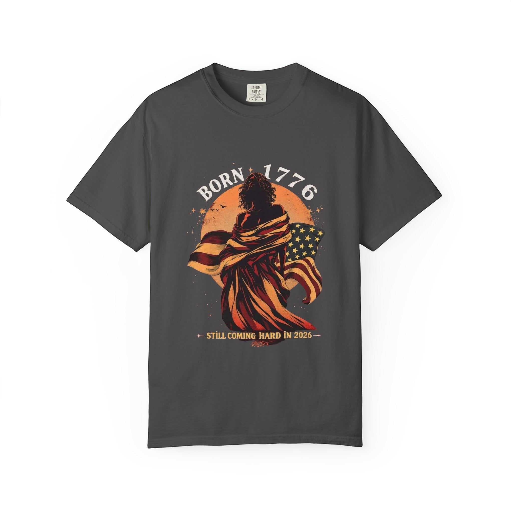 Naughty250 dark grey cotton t-shirt with "Born 1776" graphic featuring a figure wrapped in the American flag.
