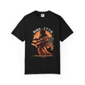 Naughty250 black cotton t-shirt with a graphic of a woman draped in the American flag, "Born 1776" text, and "Still Coming Hard in 2026" slogan.