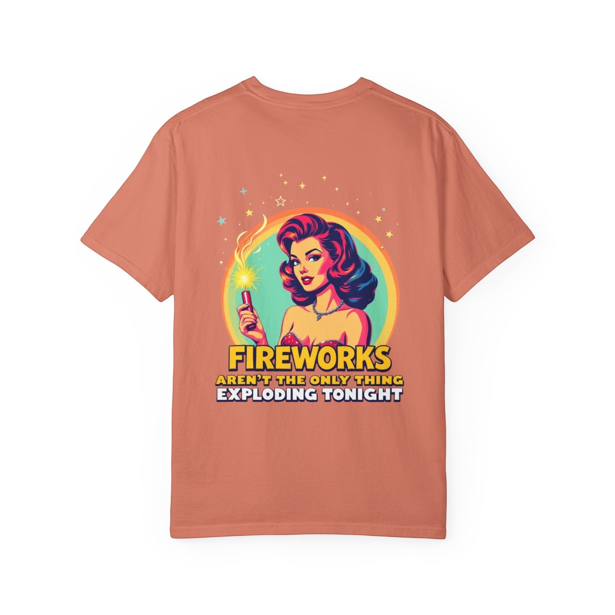 Naughty250 coral graphic tee with retro pin-up girl holding a sparkler and text "Fireworks Aren't the Only Thing Exploding Tonight". 100% cotton.