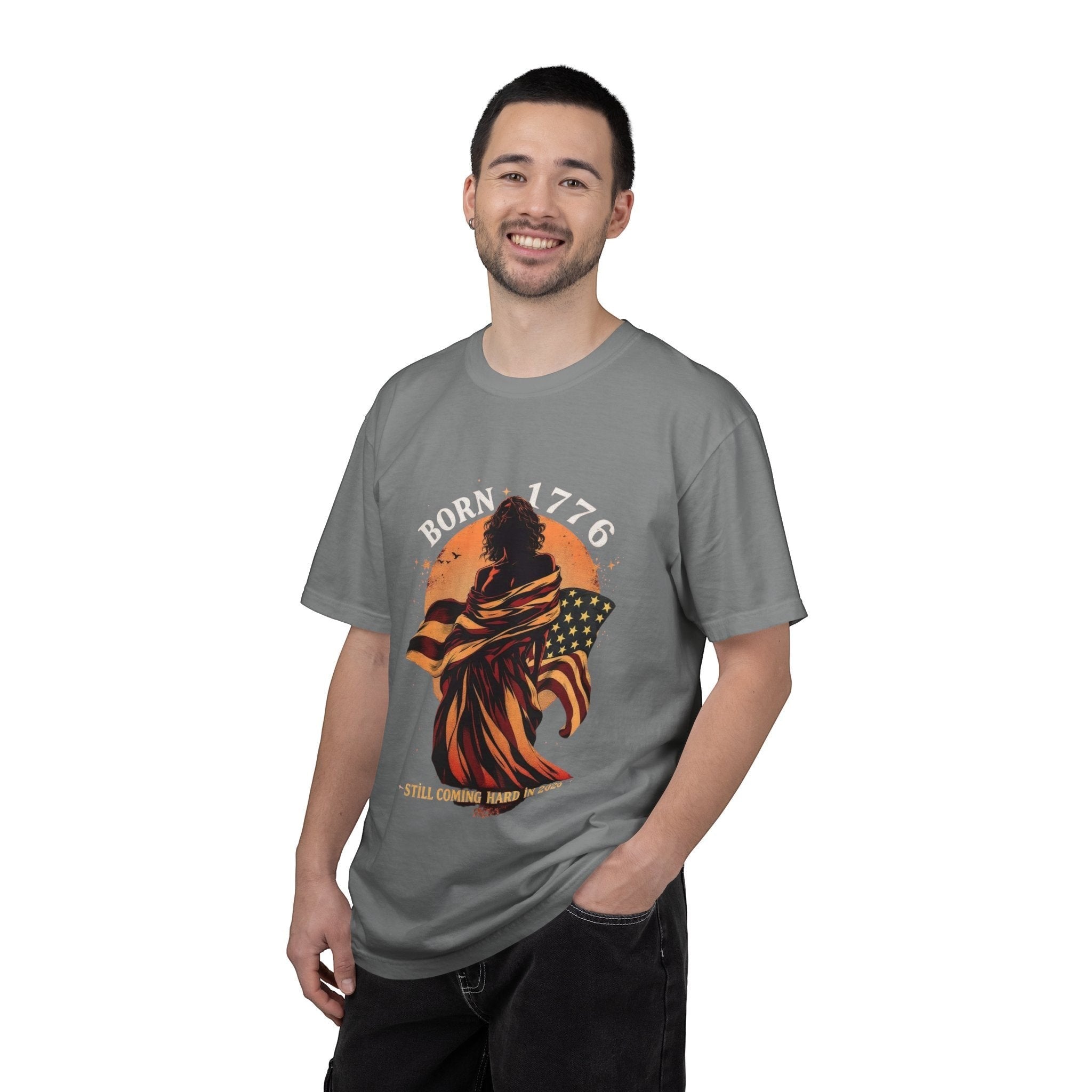 Naughty250 grey cotton t-shirt with a graphic of a figure wrapped in the American flag and "Born 1776" text.