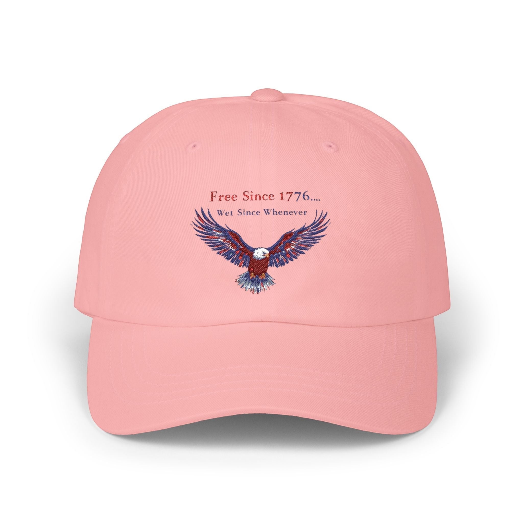 Naughty250 pink 100% cotton dad cap with embroidered eagle and "Free Since 1776... Wet Since Whenever" text.
