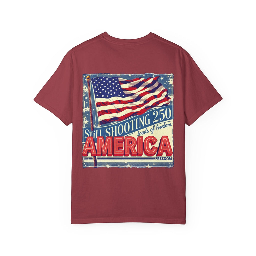 Naughty250 maroon heavyweight cotton tee with vintage American flag graphic and "Still Shooting 250 America Loads of Freedom" text.