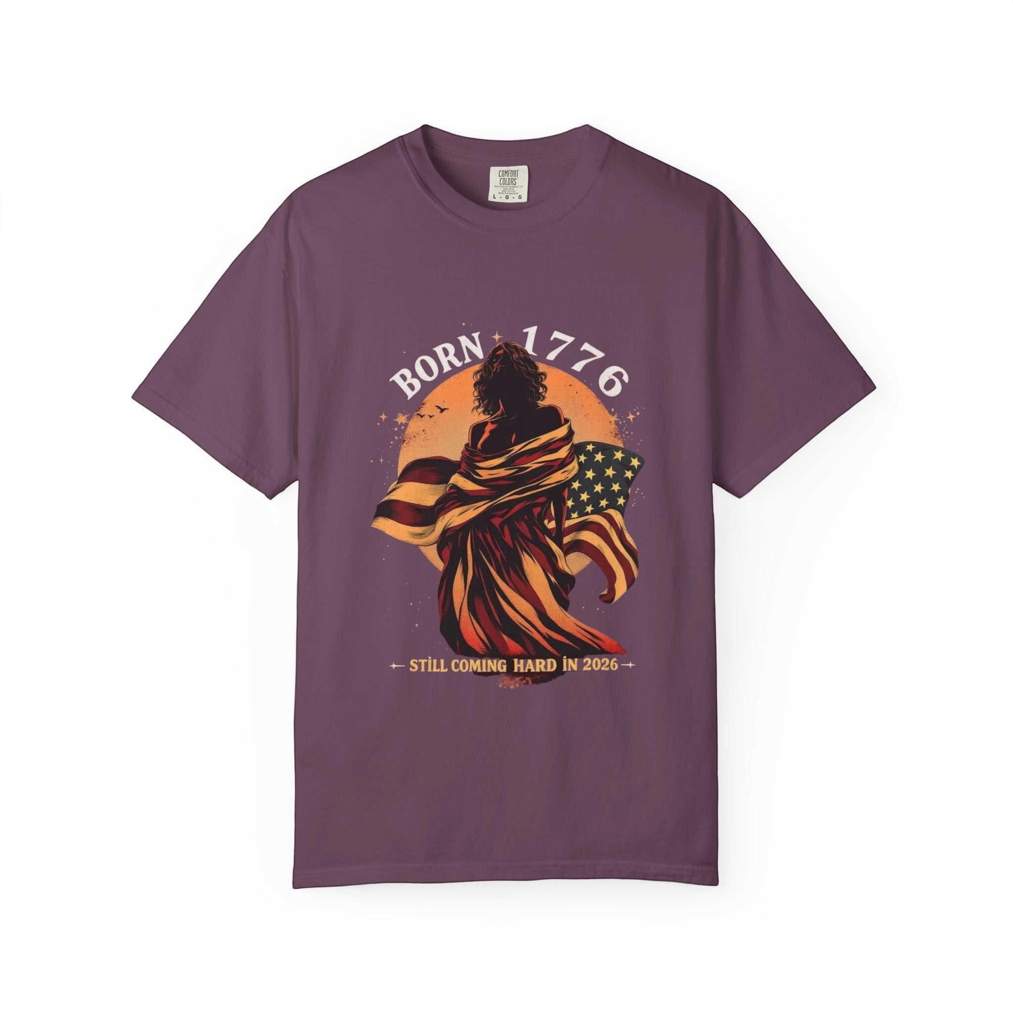 Naughty250Here Born 1776 graphic tee, featuring a figure wrapped in the American flag, celebrating USA's 250th anniversary.
